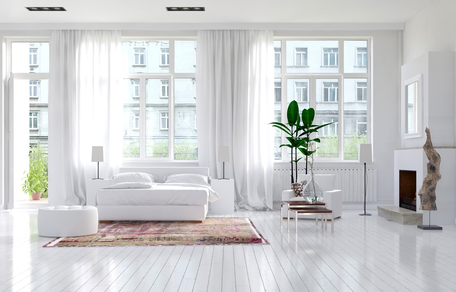 Jednoduché splývavé záclony pomohou zútulnit každý prostor. Zdroj: http://www.bigstockphoto.com/image-94387715/stock-photo-large-spacious-monochromatic-white-bedroom-with-fireplace%2C-a-double-bed-and-large-view-windows-with
